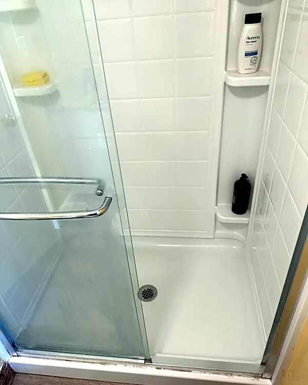 The same shower, bright white after cleaning